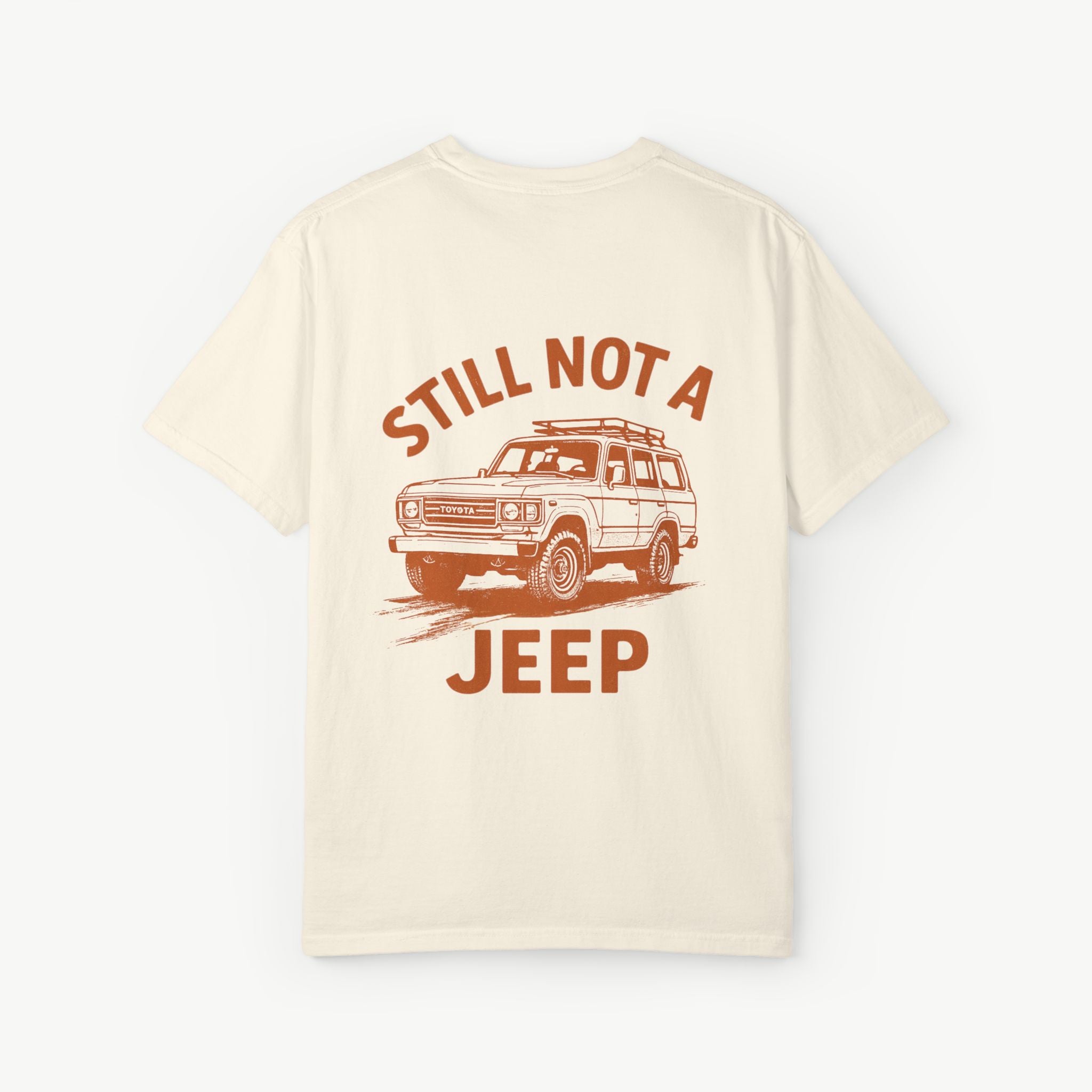 Ivory FJ60 ‘Still Not a Jeep’ shirt with vintage Toyota Land Cruiser graphic on the back.