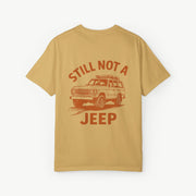 Mustard FJ60 ‘Still Not a Jeep’ shirt featuring vintage Toyota Land Cruiser desert graphic.