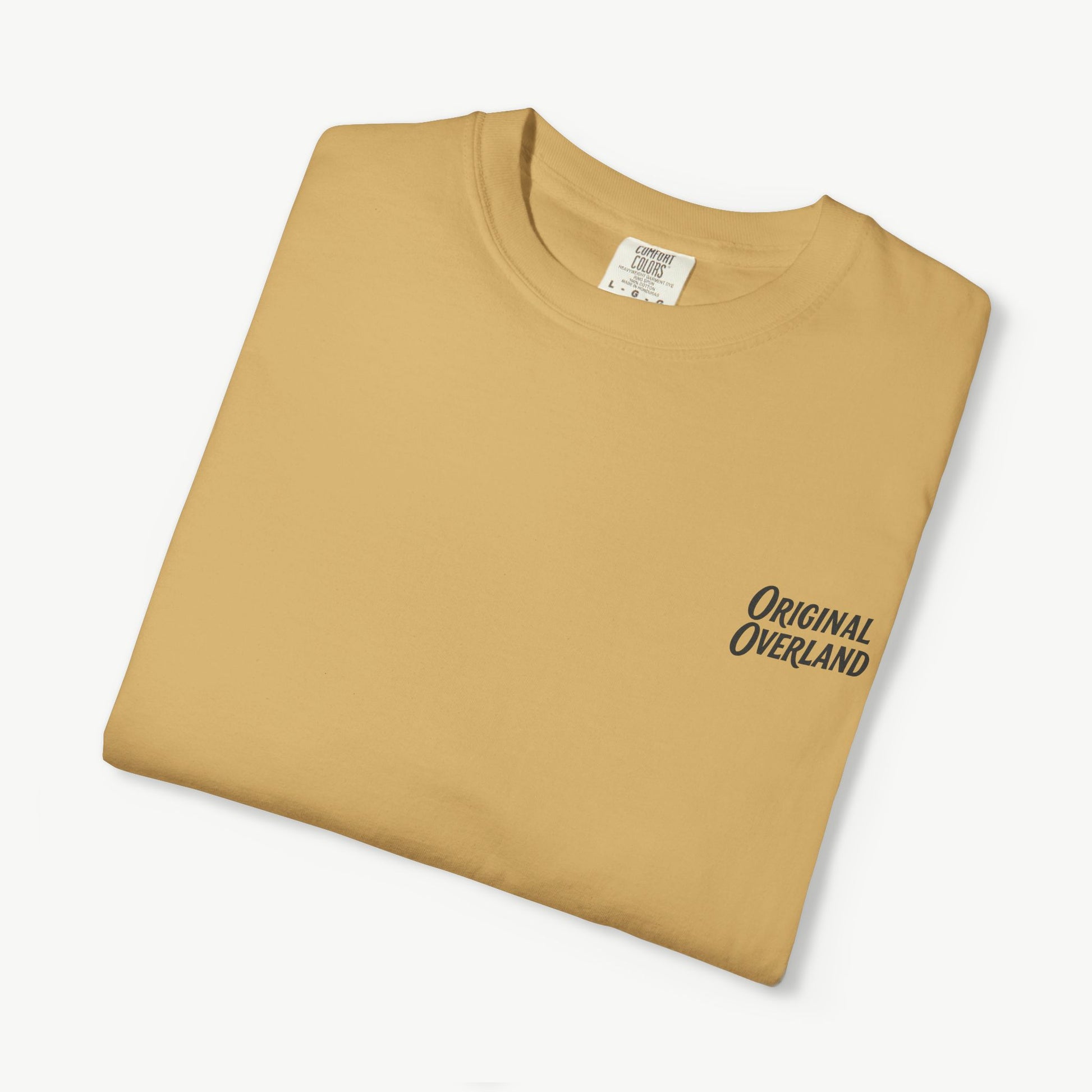 Folded mustard FJ60 ‘Still Not a Jeep’ shirt with front logo visible.